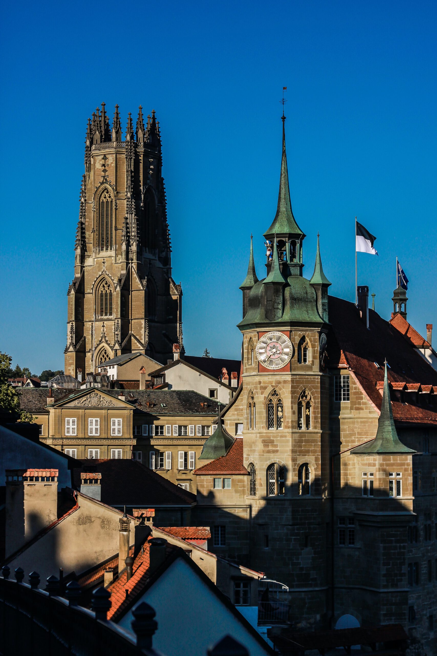 Swiss cityscape with a large church in the foreground.